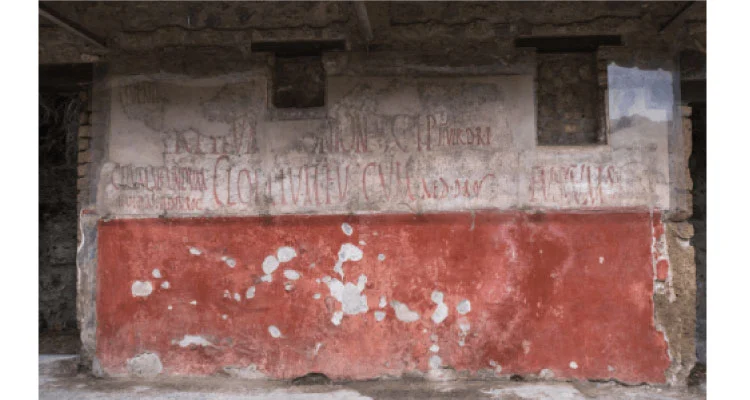 Parede com anúncios publicitários nas ruínas de Pompeia.